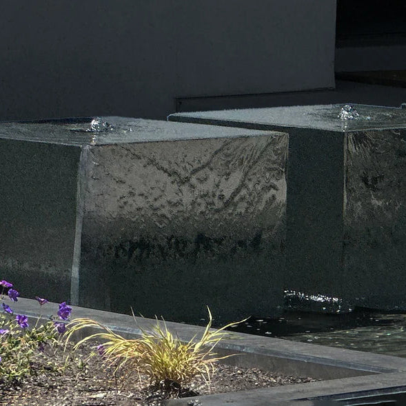 Three custom black granite cube fountains