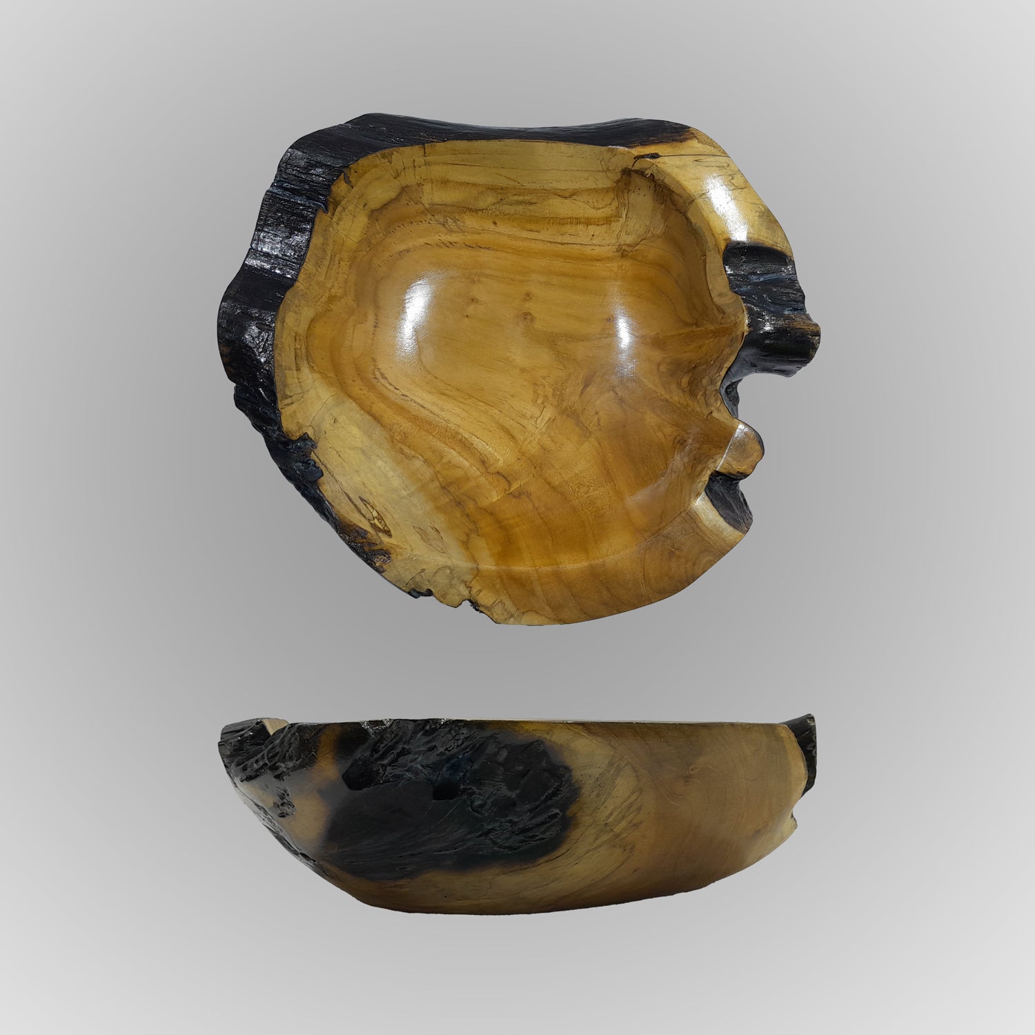 Wooden bowl with a natural, rustic finish on a gray background