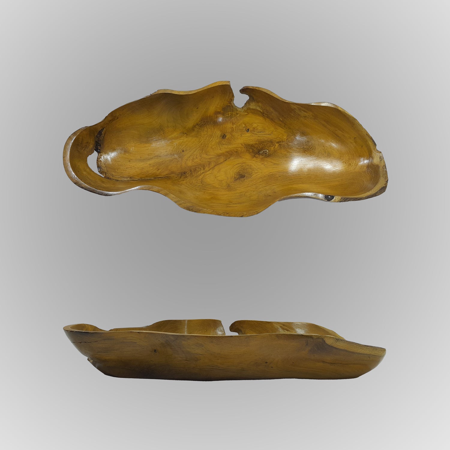 Wooden fruit-shaped dish on a gray background