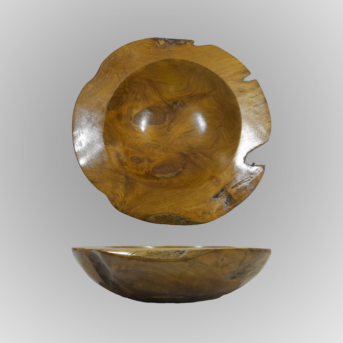 A hand-carved teak wood bowl with a smooth finish, showing natural wood grain, is displayed on a gray background image 2 of 6
