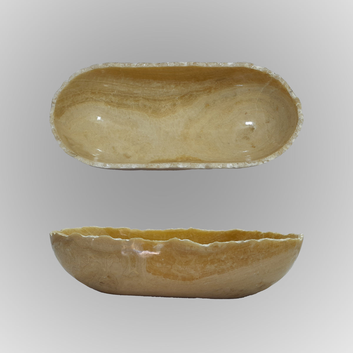 A free form onyx bowl with a smooth, curved shape against a gray background. image 6 of 6