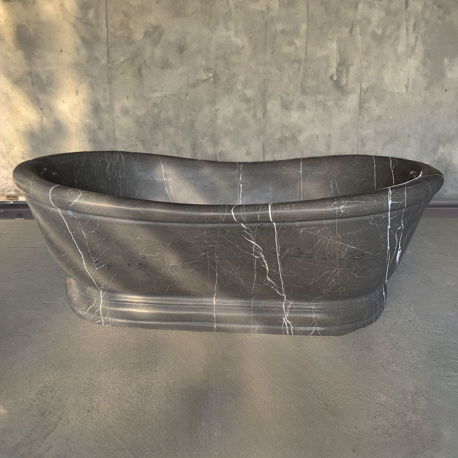 Custom Old World Bathtub carved from a block of marquina taupe