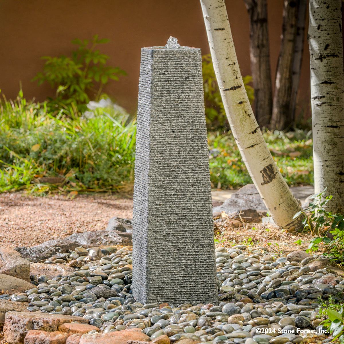 The Obelisk Fountain is a stone pillar, typically having a square cross-section and a pyramidal top. Set it up as a monument or landmark. Carved from Black & White Granite. image 1 of 2
