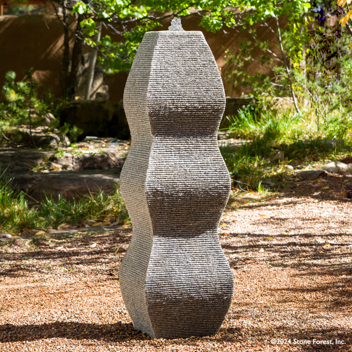 The Wave Fountain sculpted from a block of black & white  granite. image 1 of 5