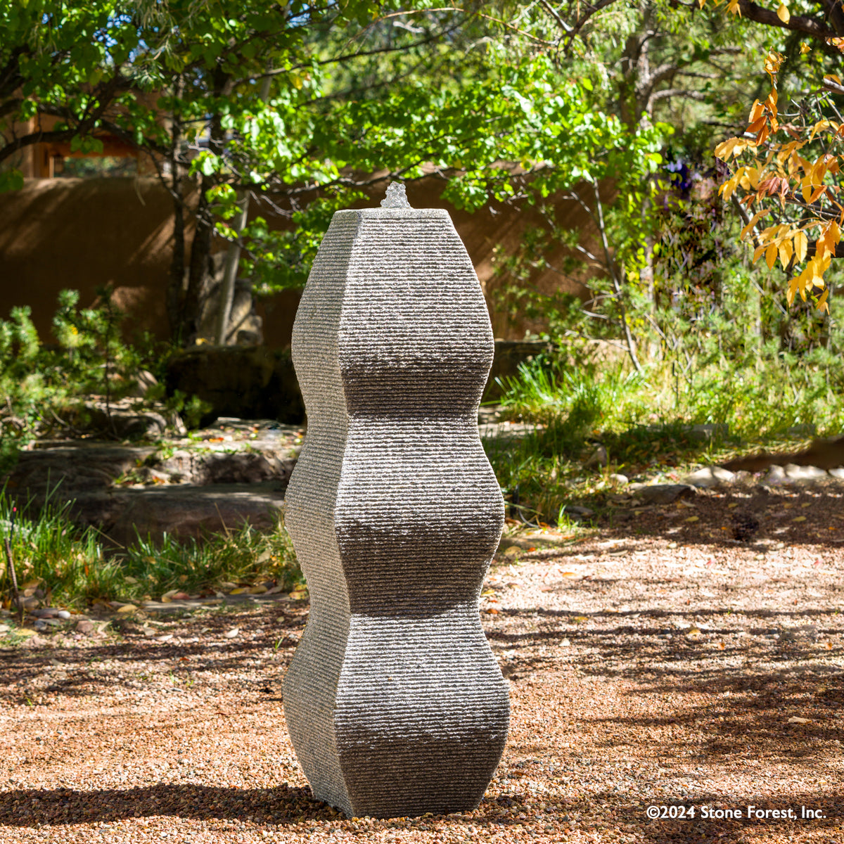 The Wave Fountain sculpted from a block of black & white  granite. image 2 of 5