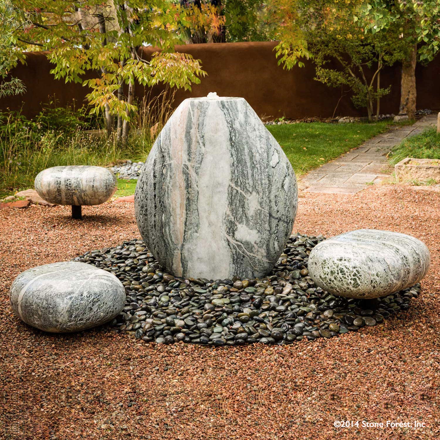 Stone Forest hand carved Pebble Garden Fountain and seats carved from green marble