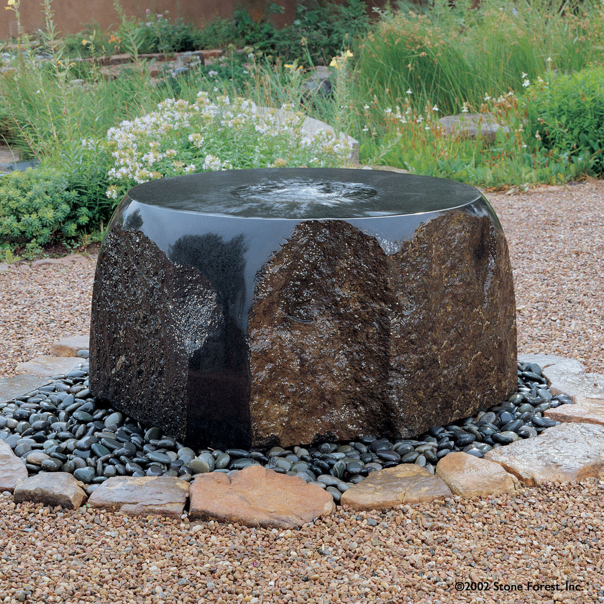 Maru Garden Fountain carved from basalt. image 1 of 2