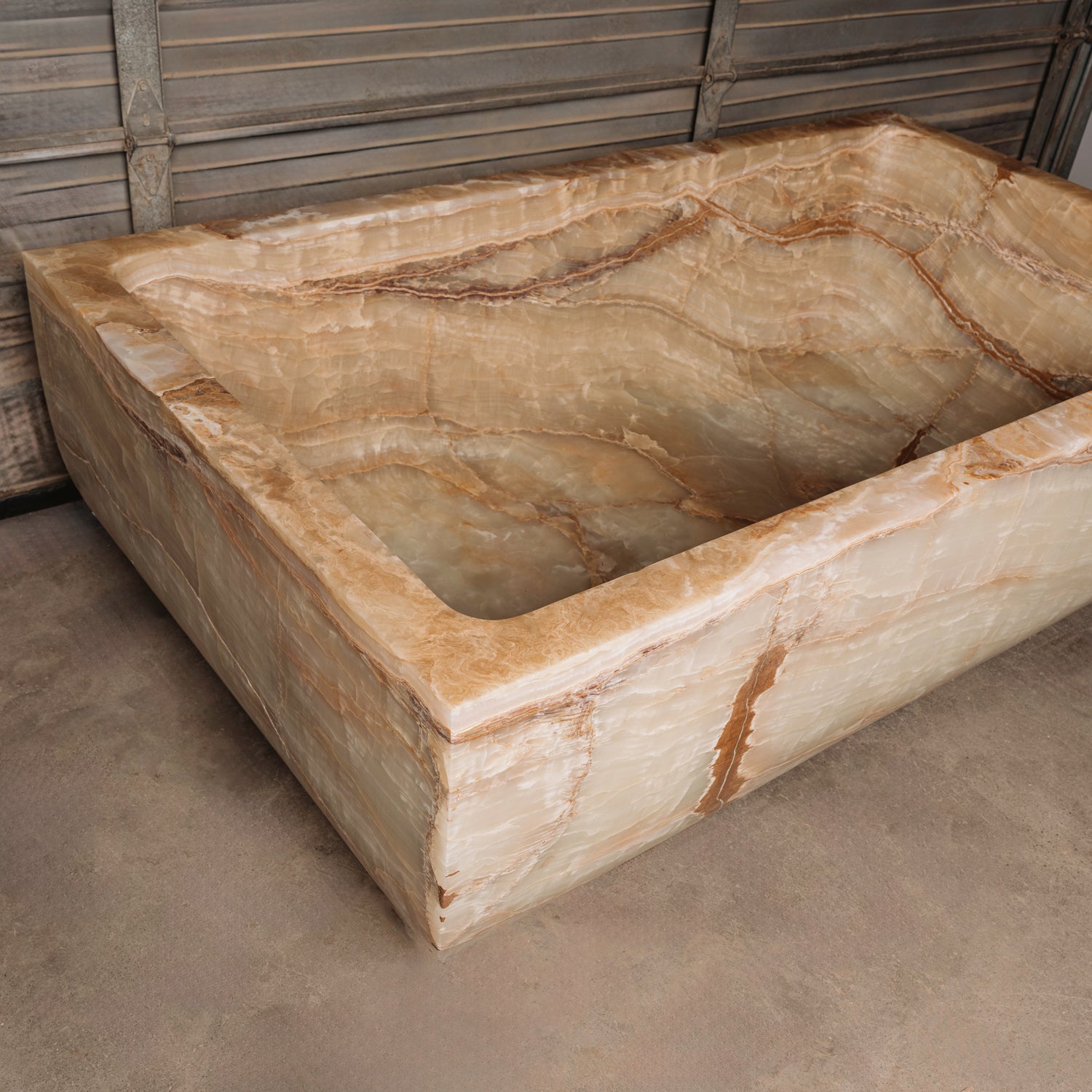 A large, rectangular onyx trough planter with multi-color patterns, displayed indoors.
