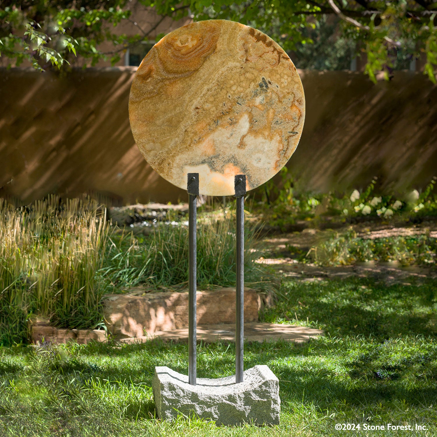 Gallery-worthy hanging sculptures carved from blocks of beige onyx with a convex surface and honed finish. Installed using a suspension strap.
