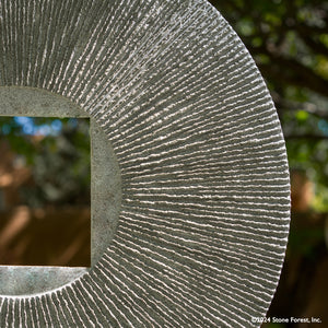 Gallery-worthy sculpture, ancient/contemporary. The hand-carved blue-gray granite pendant features a ribbed pattern on both surfaces and can be used indoors or outdoors, supported by an iron stand. image 5 of 5