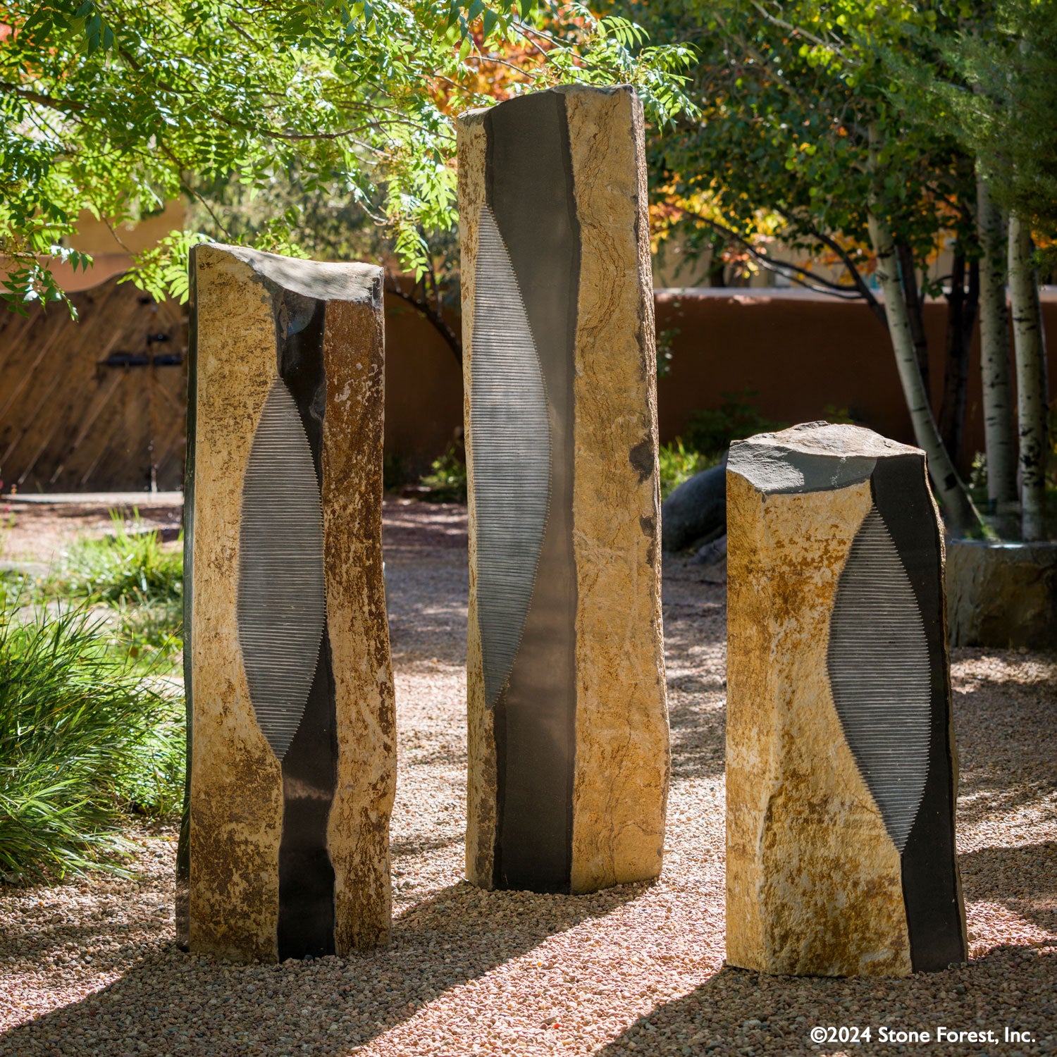Sculptural Basalt Columns are each one-of-a-kind. These unique custom sculptural pieces can be ordered as shown or per your design. They are carved from natural basalt columns with ribbed, crescent-cut features. The hexagonal natural shape is finished with alternating polished and natural sides.