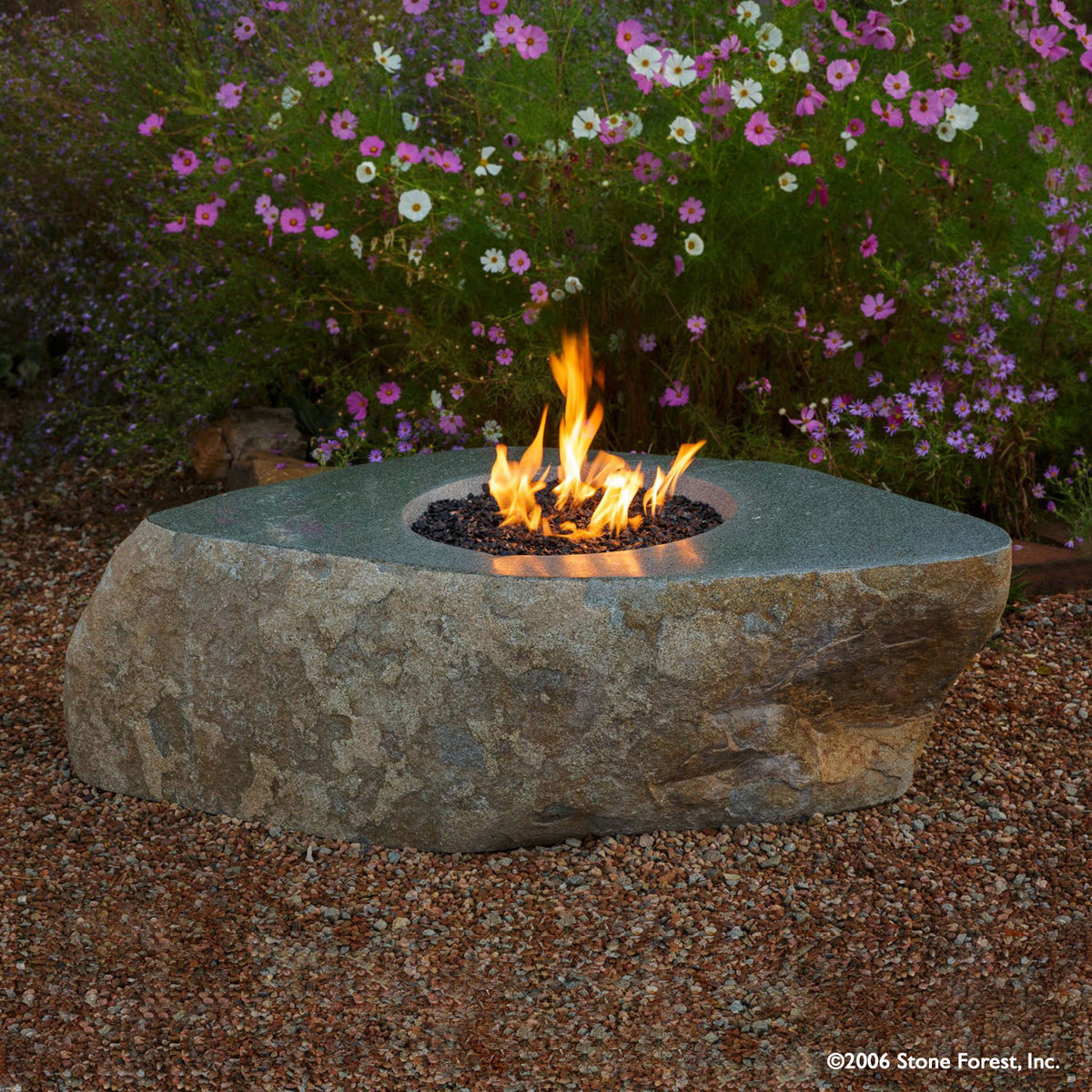 The Natural Fire Boulder is carved from a monolithic natural boulder image 1 of 2