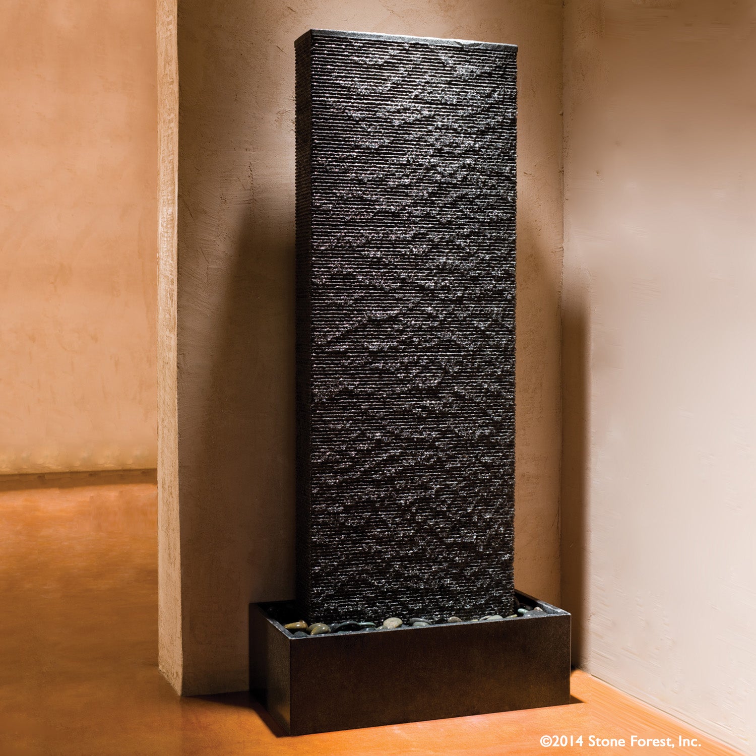 Stone Forest Ribbed Waterwall indoor fountain carved from grey granite.