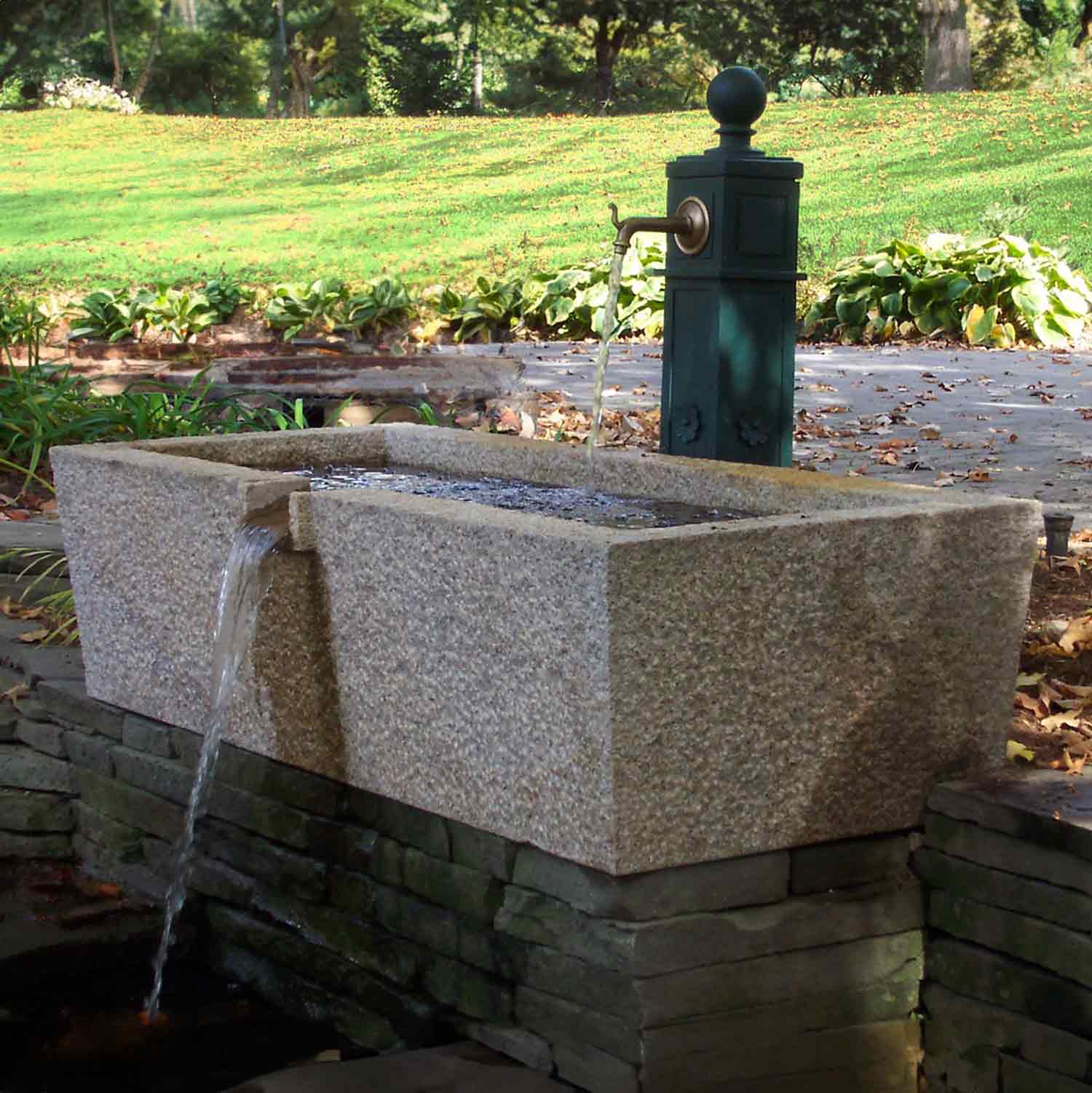 Beige granite trough fountain