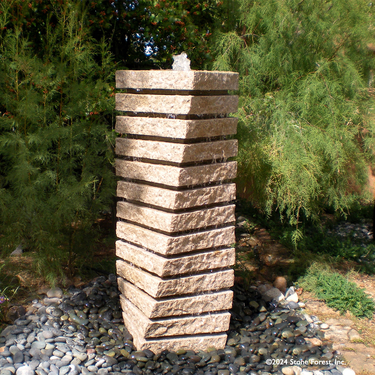 A beige granite tiered helix garden fountain. image 1 of 3