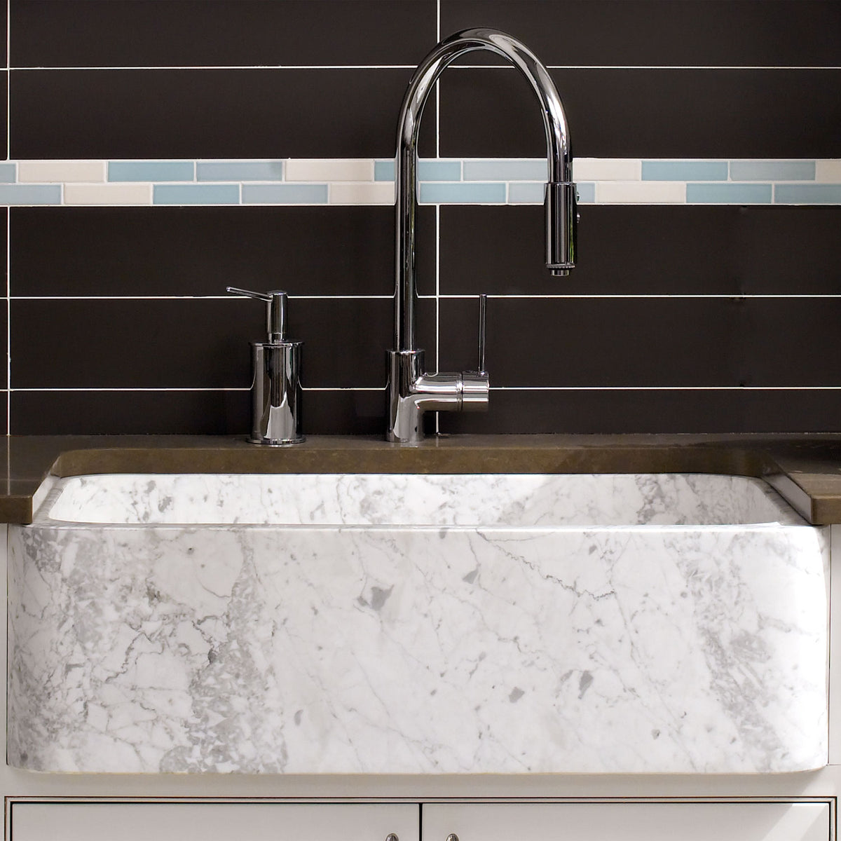 The back side of a carrara marble New Haven Farmhouse Sink has a smooth polished finish that can face forward.  image 3 of 3