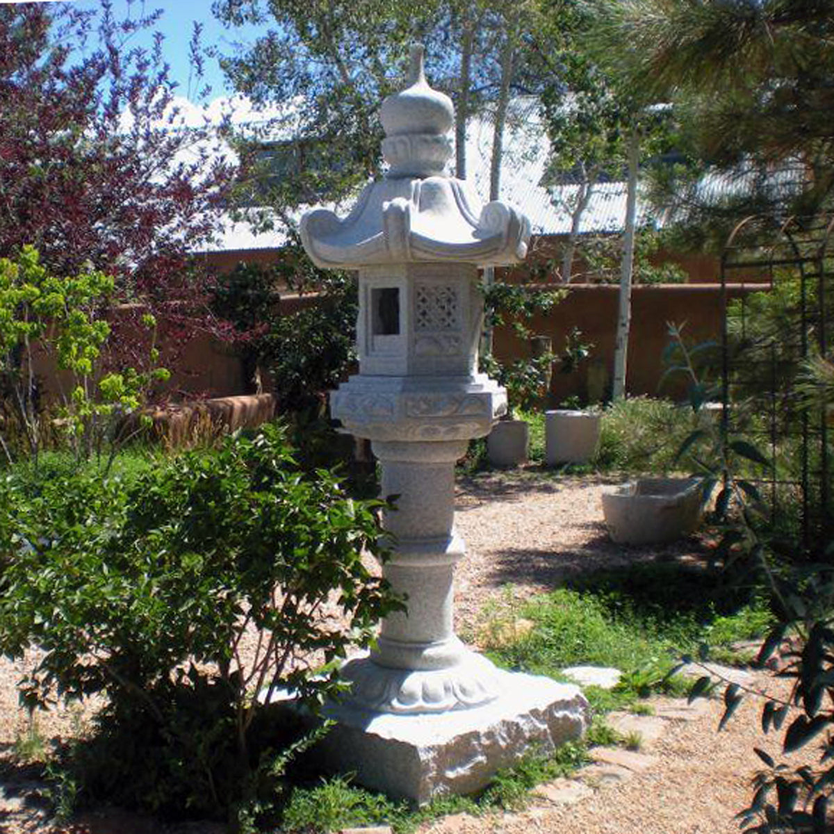 Stone Forest Kasuga-style lantern. This traditional Japanese Lantern is of the Tachi-gata-style or pedestal stone lanterns. Carved from black & white (salt & pepper) granite. 96