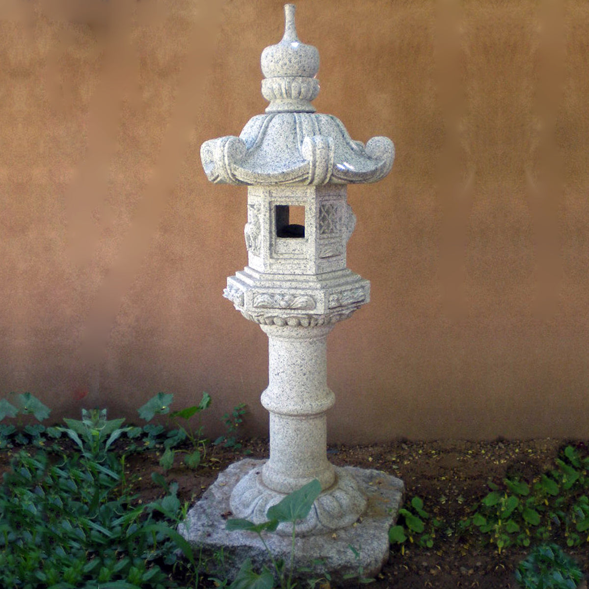Stone Forest Kasuga-style lantern. This traditional Japanese Lantern is of the Tachi-gata-style or pedestal stone lanterns. Carved from black & white (salt & pepper) granite. image 1 of 5