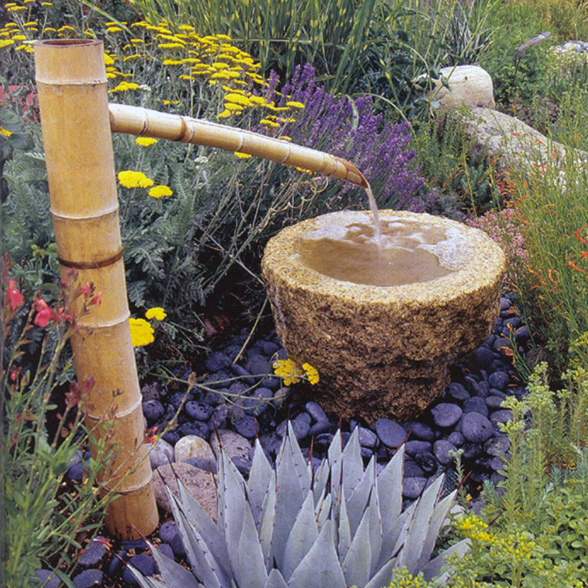 Bamboo water spout for use with basin-style fountains. image 1 of 2