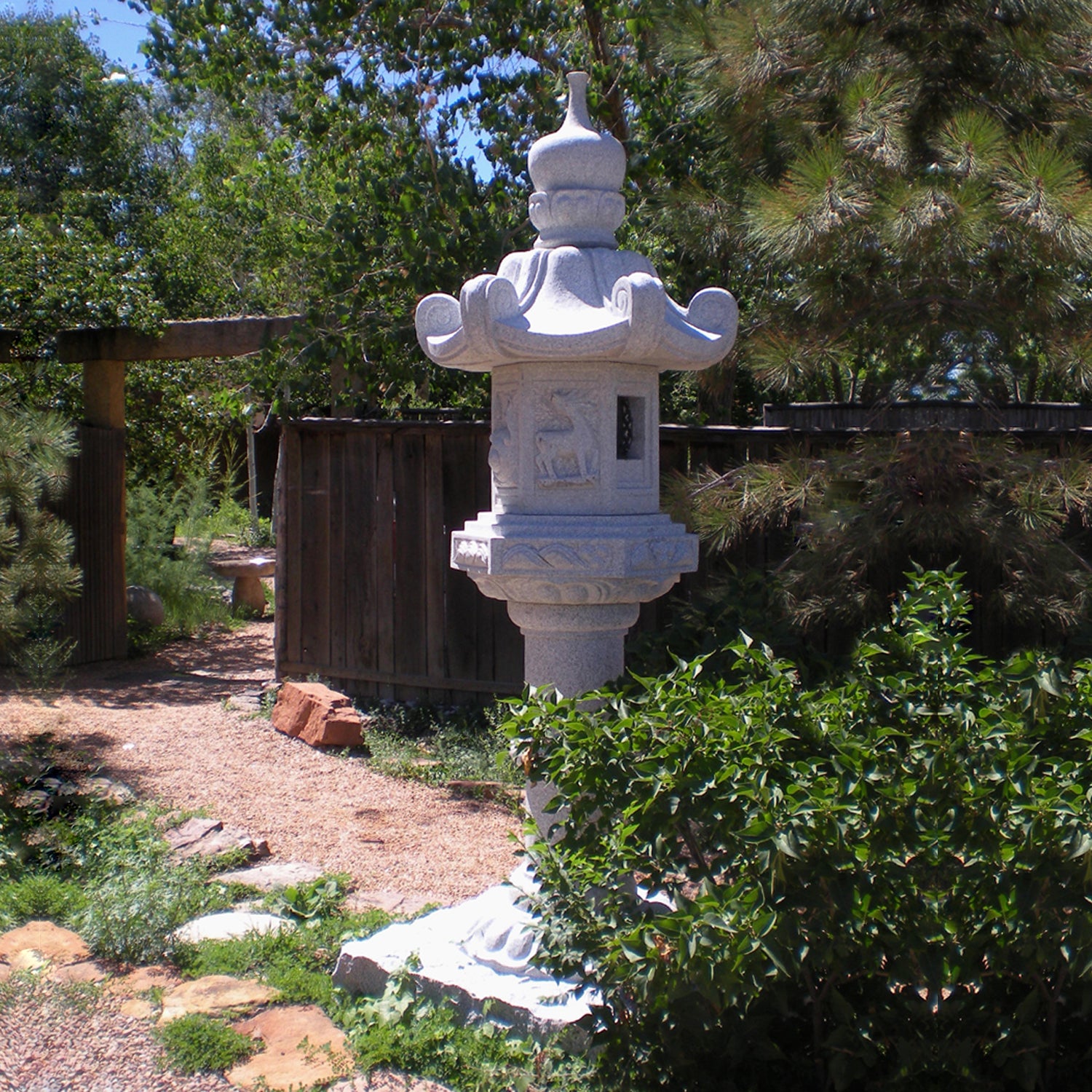 Stone Forest Kasuga-style lantern. This traditional Japanese Lantern is of the Tachi-gata-style or pedestal stone lanterns. Carved from black & white (salt & pepper) granite. 96"h