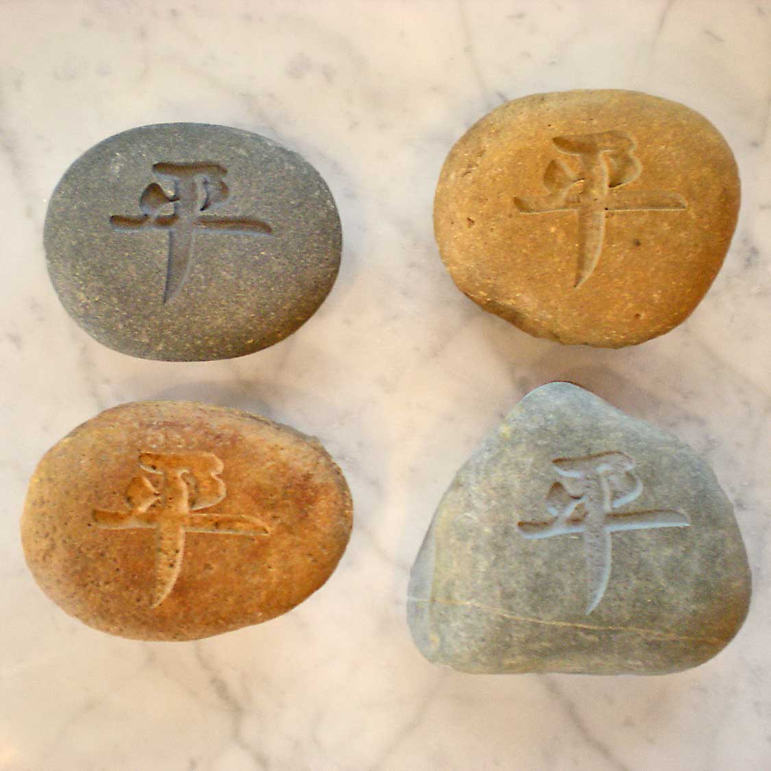 Stone Forest Peace Character Pebbles are  each uniquely carved from natural river pebbles image 2 of 7