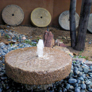 Stone Forest small antique millstone used as a garden fountain image 2 of 2