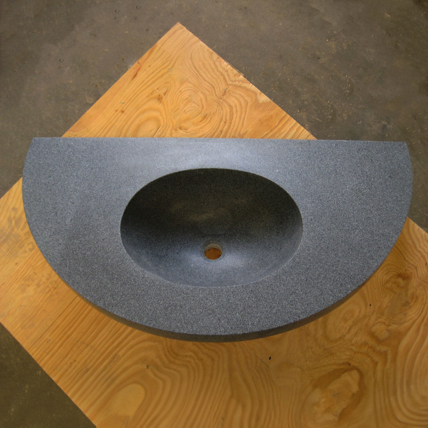 Custom Lavatory Vanity carved from blue gray granite