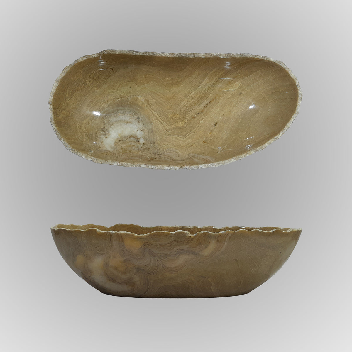 A free-form onyx bowl with a smooth, curved shape against a gray background. image 9 of 9