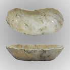 A free-form onyx bowl with a smooth, curved shape, off-white with brown highlights.