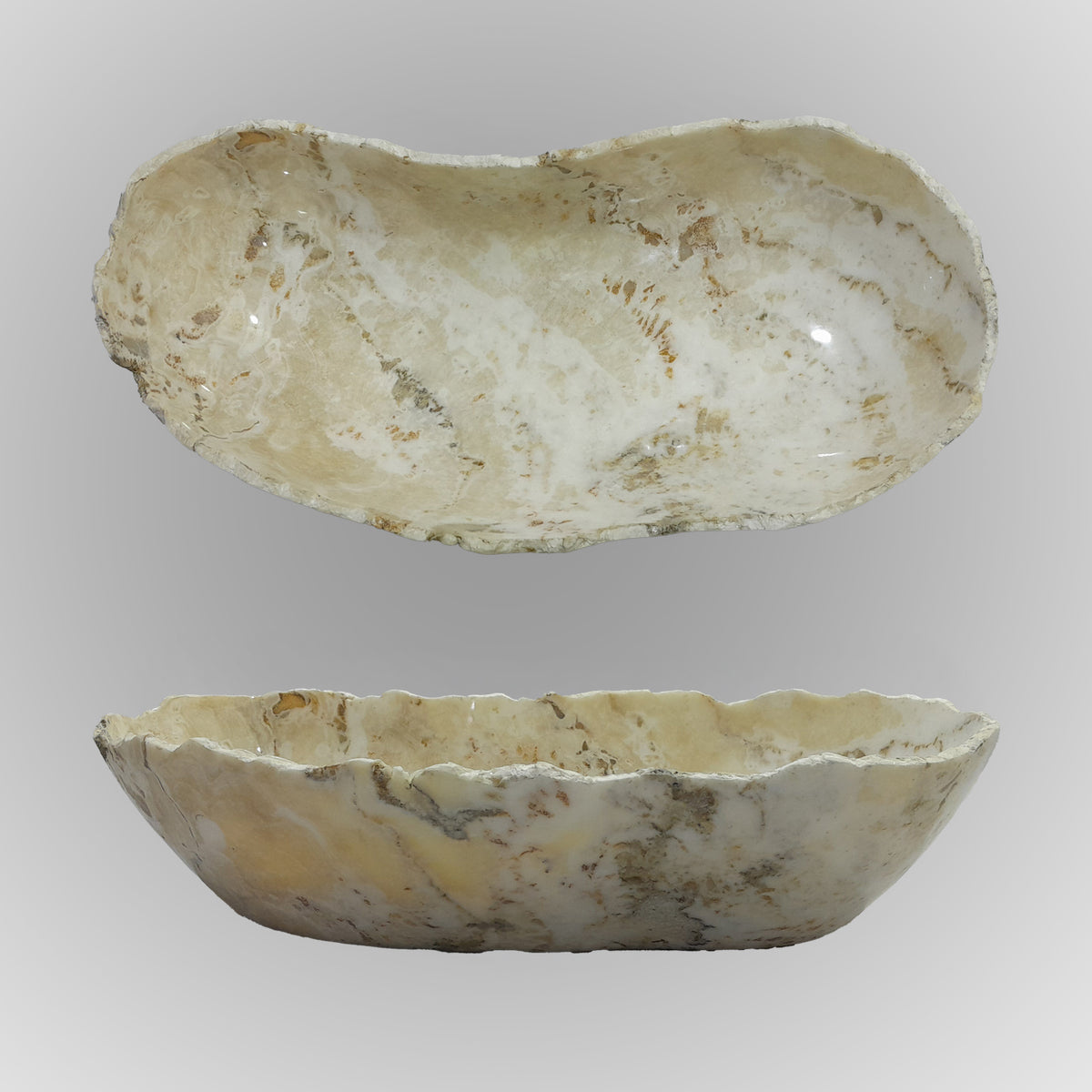 A free-form onyx bowl with a smooth, curved shape, off-white with brown highlights.