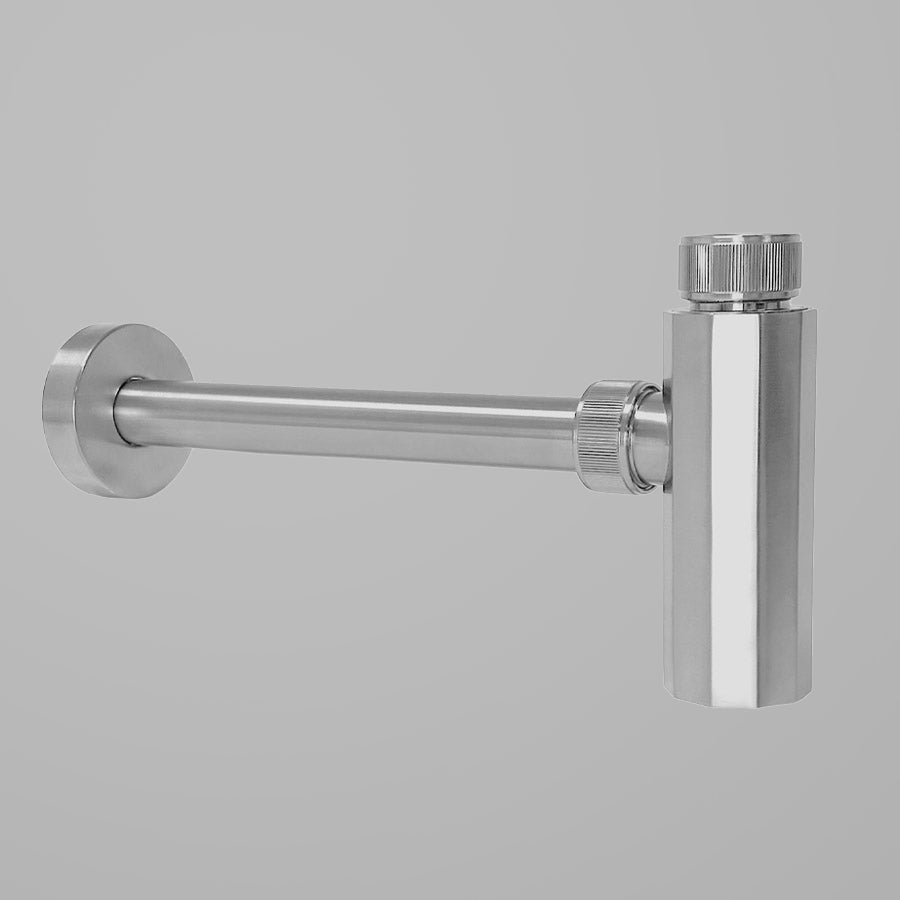 A polished nickel lavatory trap with a wall outlet and inlet, part of the Elemental Collection.