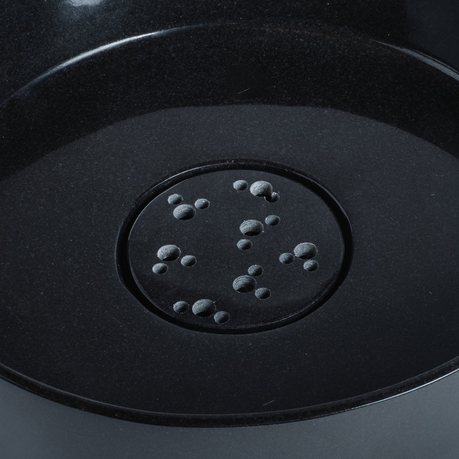  thin-walled vessel sink is carved from a solid block of black granite and finished to a high polish; Drain cover is included.
