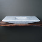 rectangular-shaped carrara marble vanity sink with a polished finish