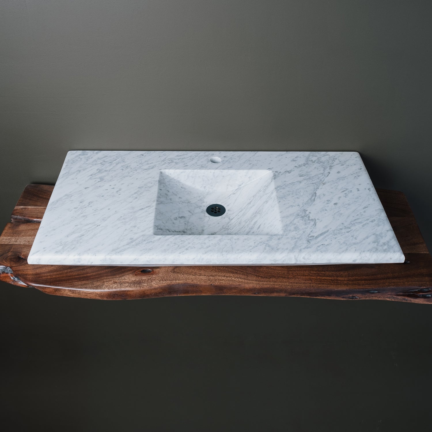 rectangular-shaped carrara marble vanity sink with a polished finish