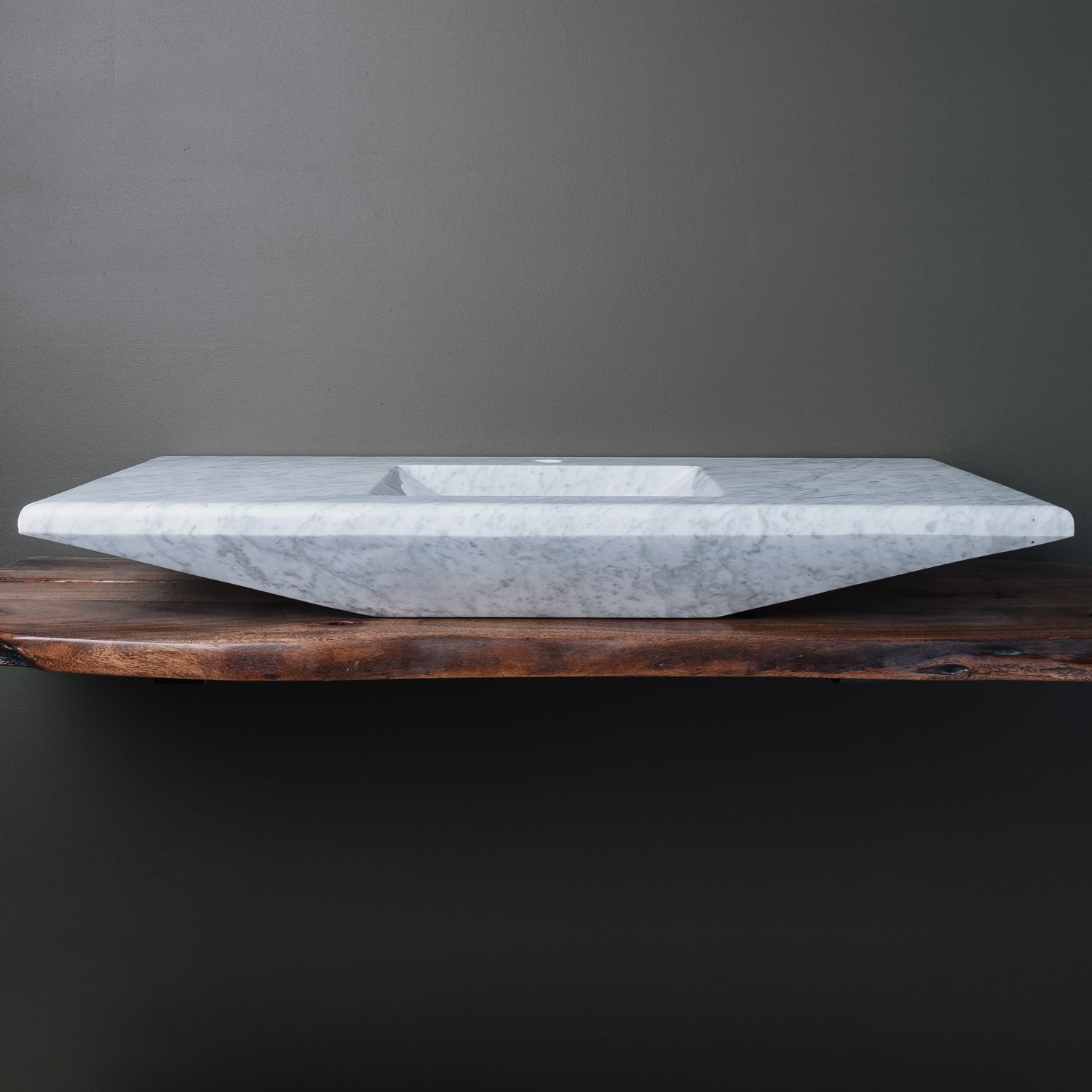 rectangular-shaped carrara marble vanity sink with a polished finish