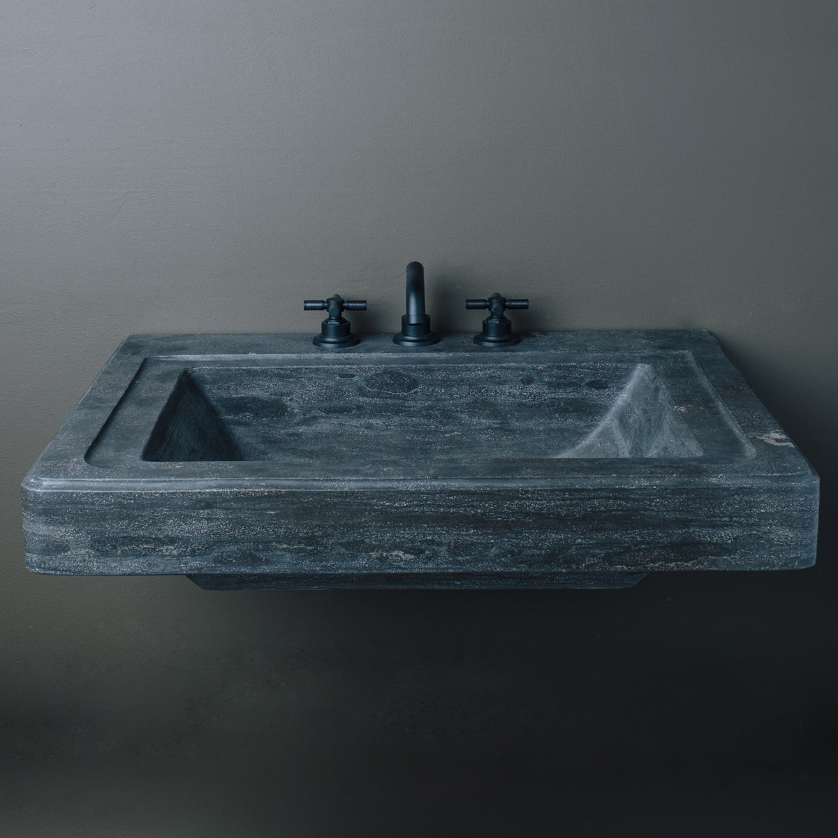 This Stone Forest Circa vanity sink is one-of-a-kind. It is carved from a single block of antique gray limestone and has a honed finish. image 2 of 3