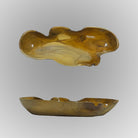 Wooden bowl with natural edge design on a gray background