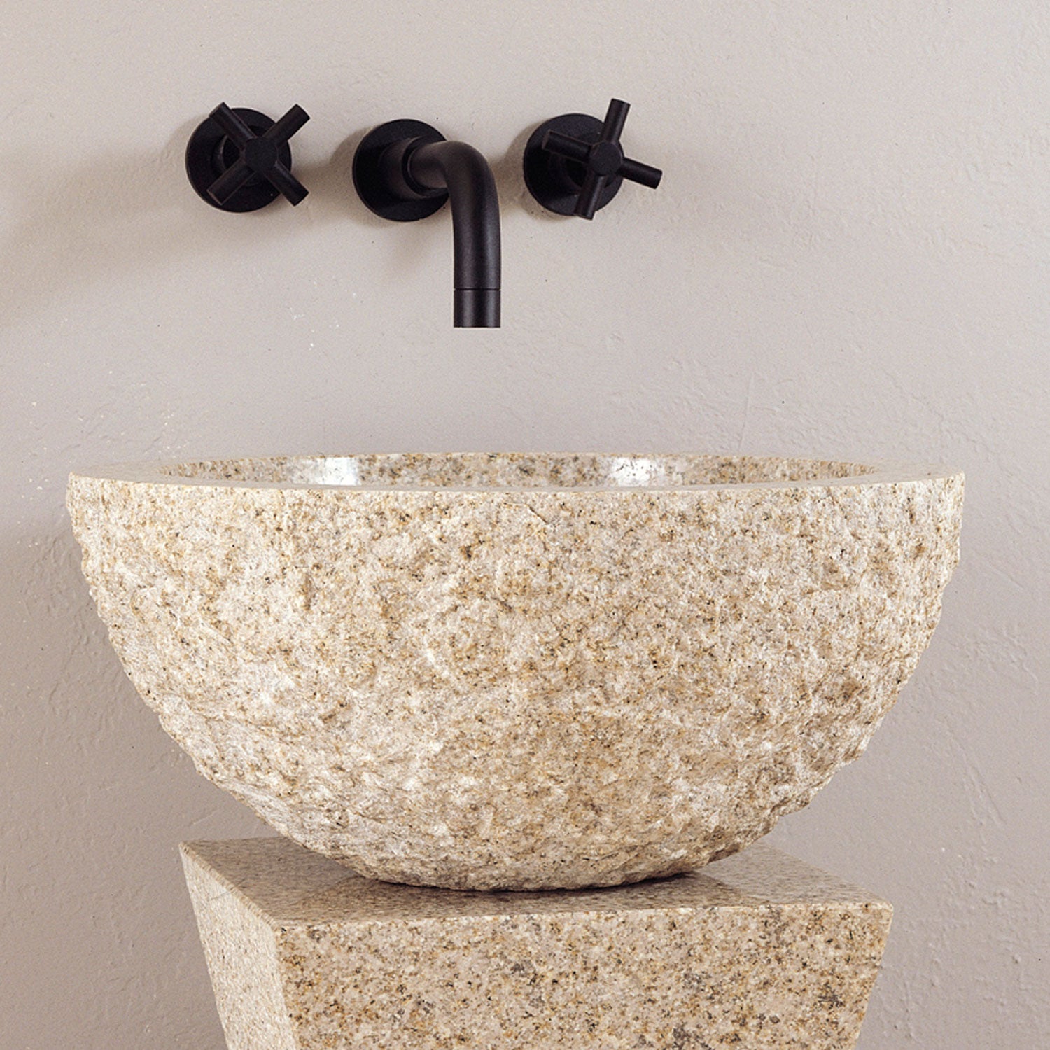Rough chiseled vessel sink in beige granite
