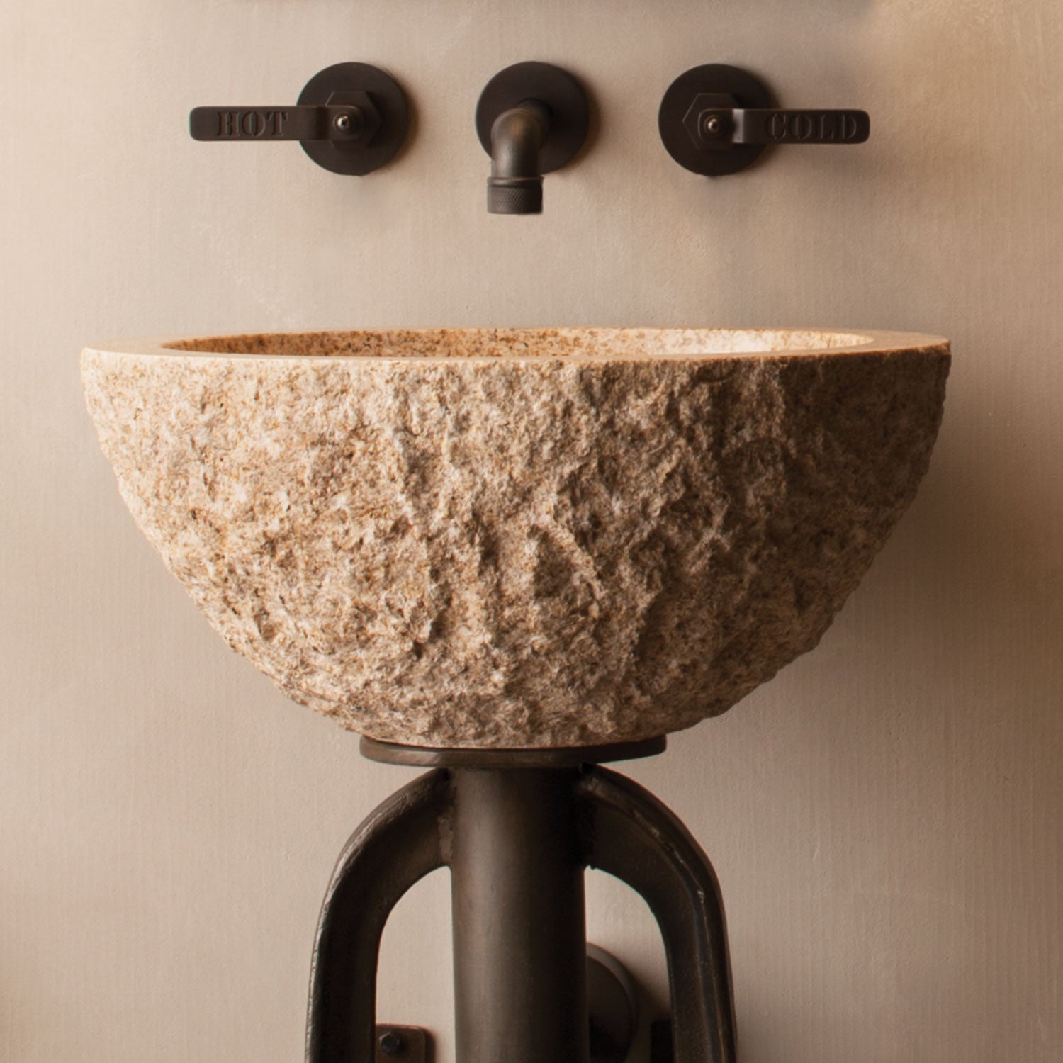 rough chiseled vessel sink in beige granite