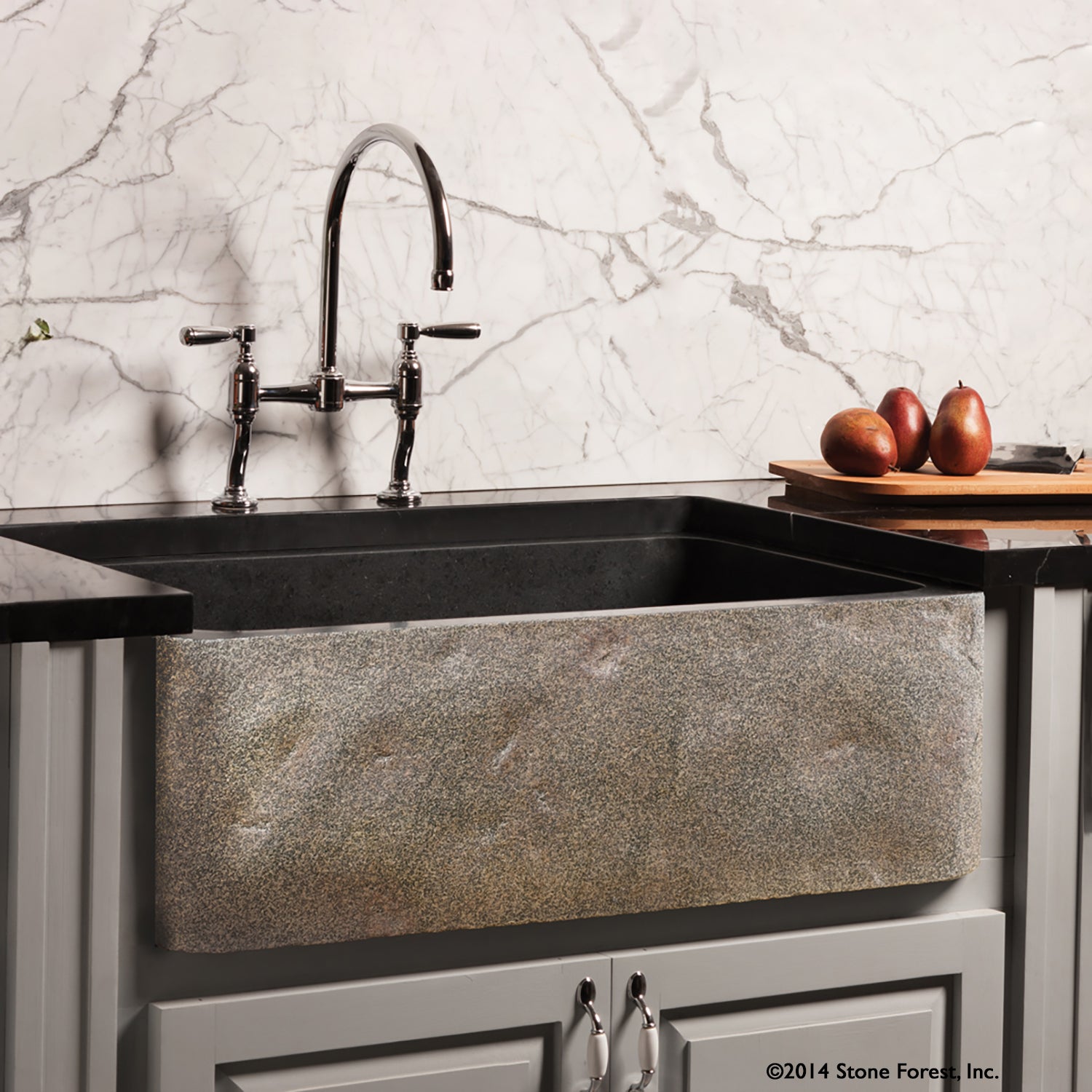 Natural Front Farmhouse sink features a polished finish on the interior and the rim of the sink and a natural stone look on the apron.