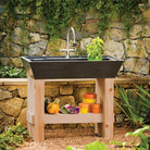 Salus Potting Sink in honed black granite. 