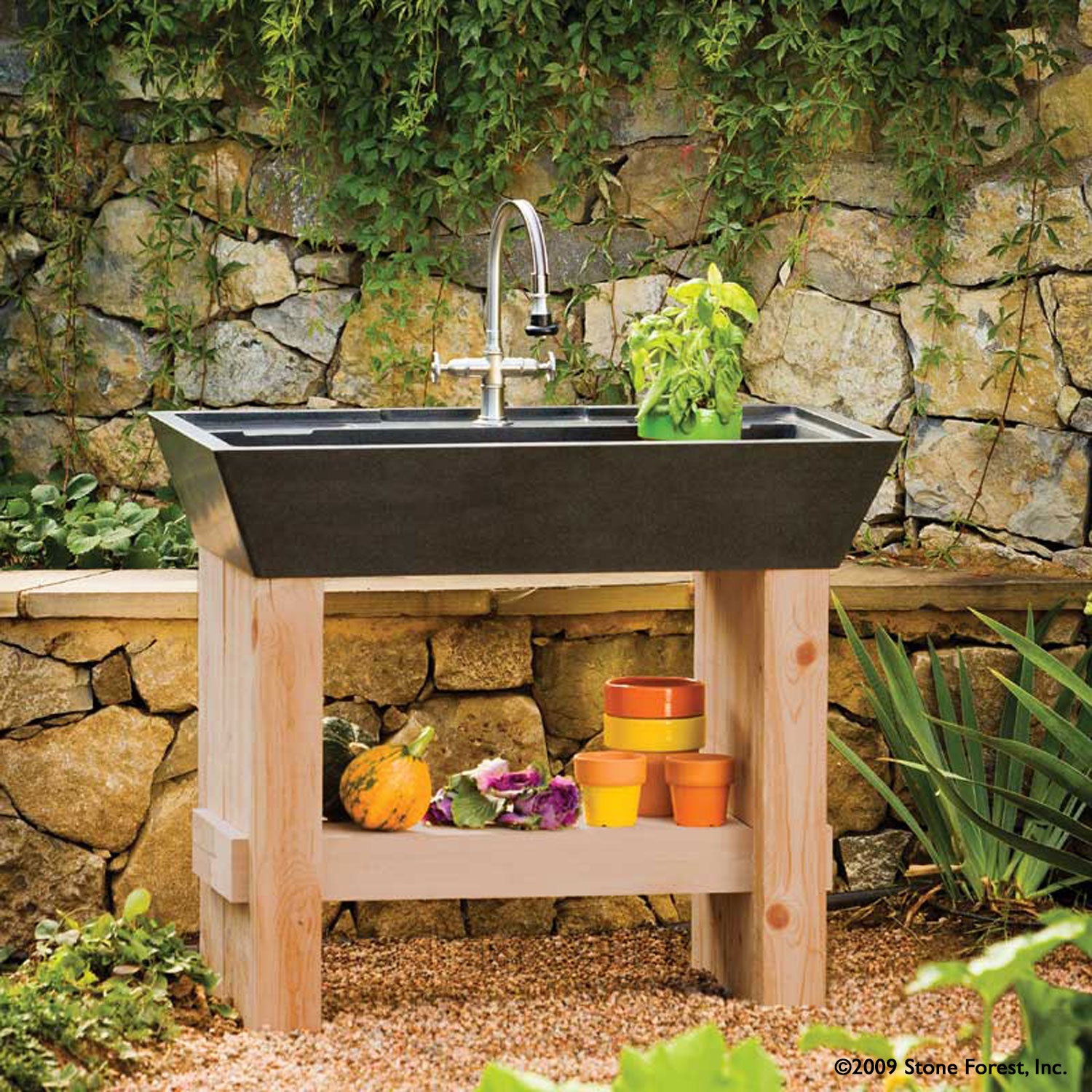 Salus Potting Sink in honed black granite. 