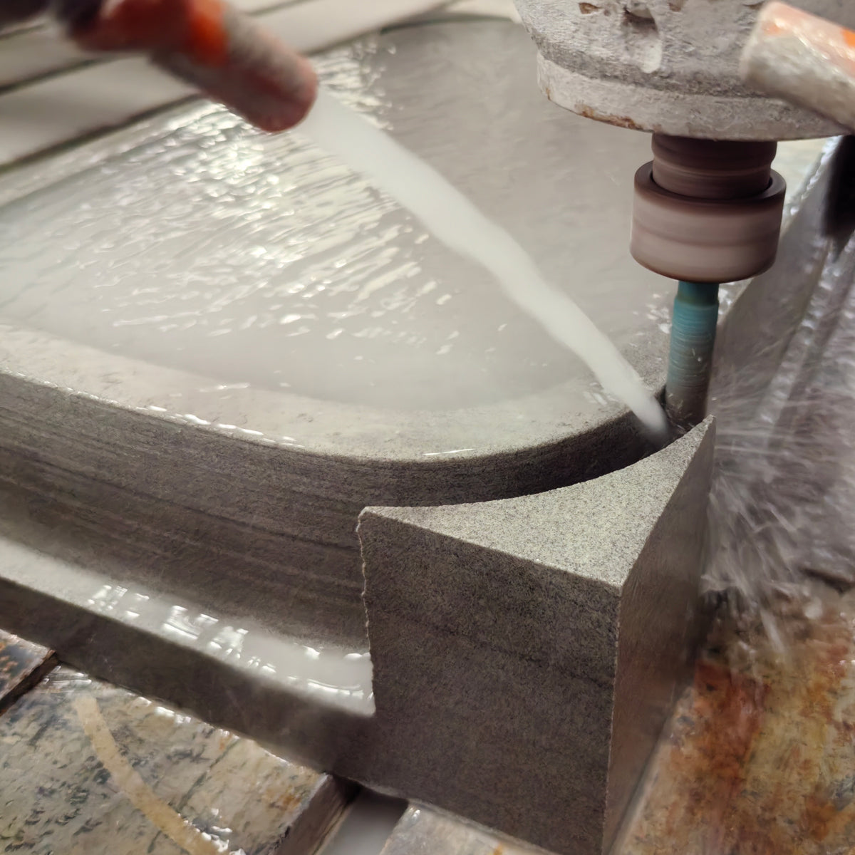 Forma vessel sink being shaped in grigio sandstone