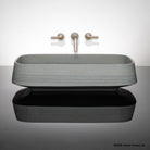 Forma Vessel Sink carved from grigio sandstone