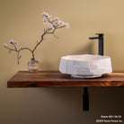 Desert cream limestone Edo vessel sink on wood countertop.