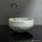 Round vessel sink called Tazza in ocean onyx