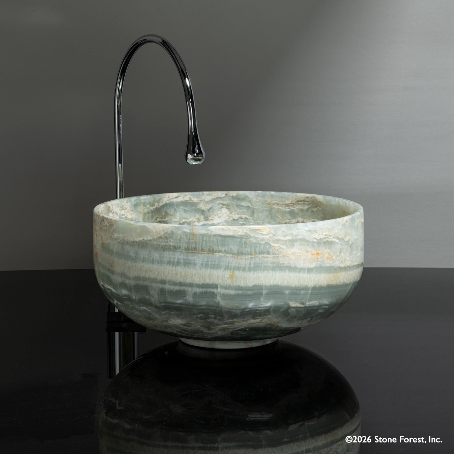 Round vessel sink called Tazza in ocean onyx