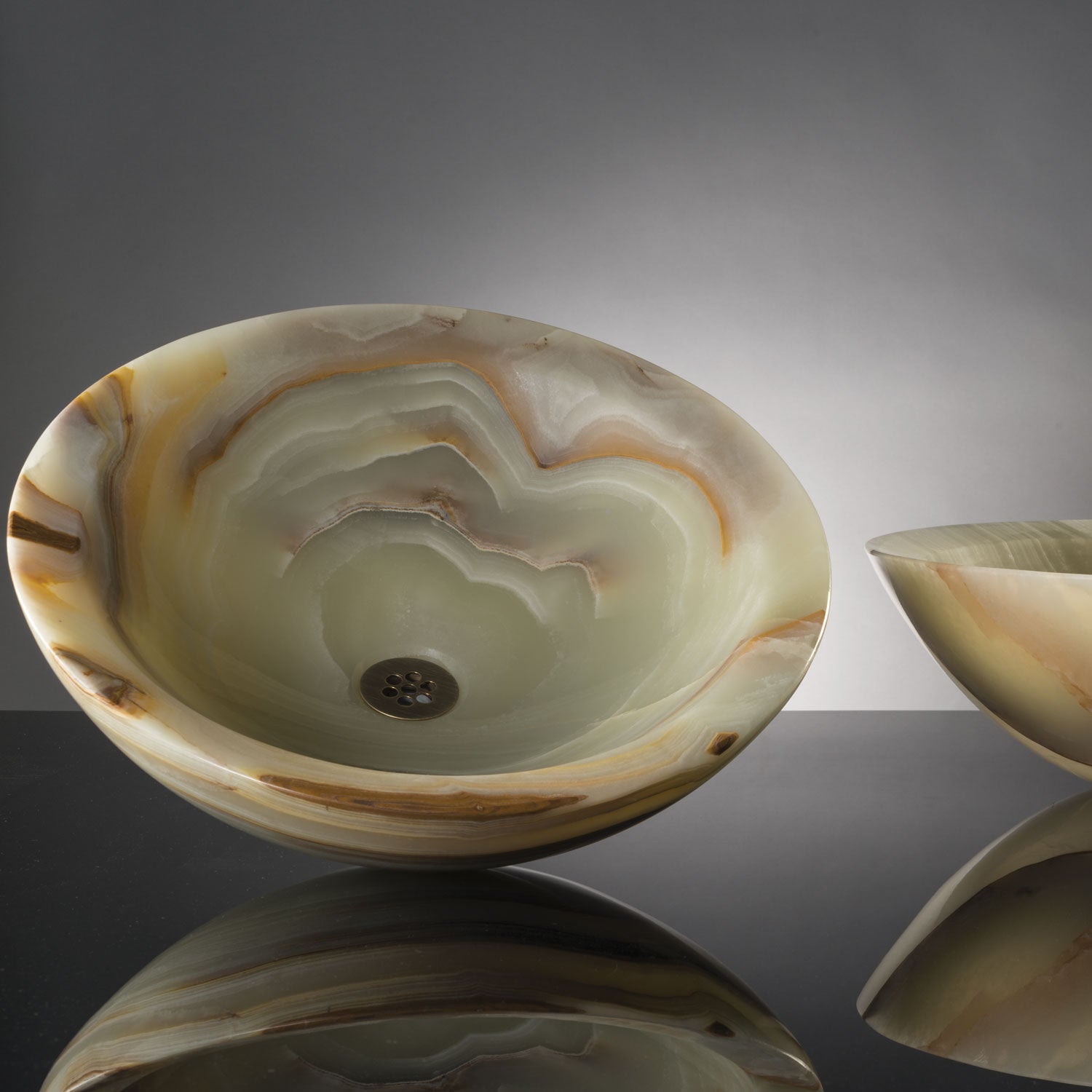 Beveled rim vessel sink in multi-onyx 