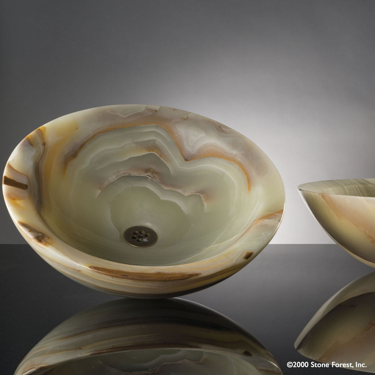  Beveled Round vessel sink carved  from multi-onyx with a polished  finish. image 1 of 3