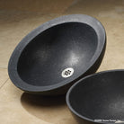 Beveled Round vessel sink carved  from basalt with a honed finish.